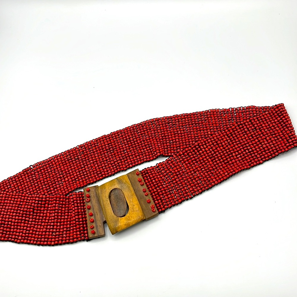 Red beaded belt with wooden clasp